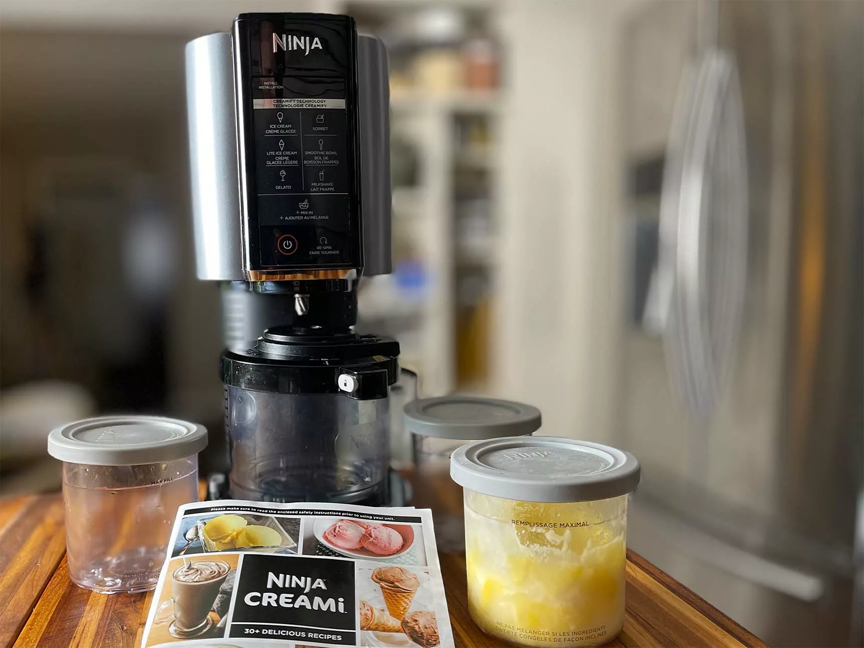 The Ninja CREAMi comes with three pint-sized containers, a recipe booklet, and the machine itself. What comes with the Ninja CREAMi?