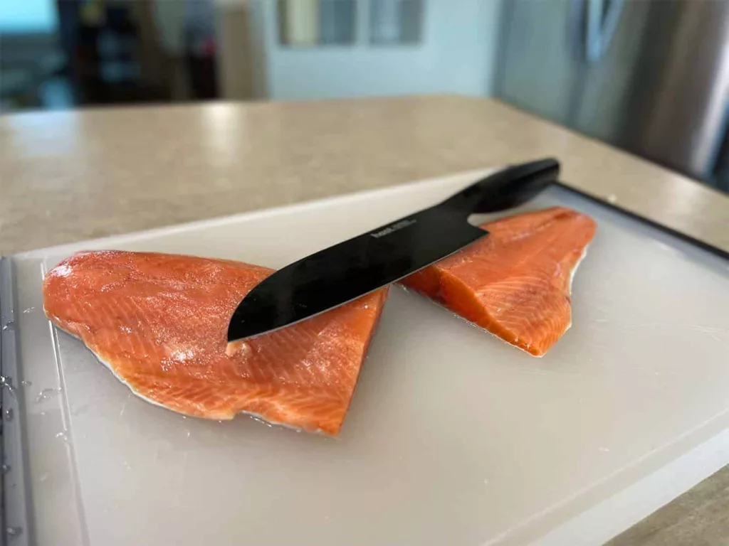 Dividing a salmon in half using a Hast knife.