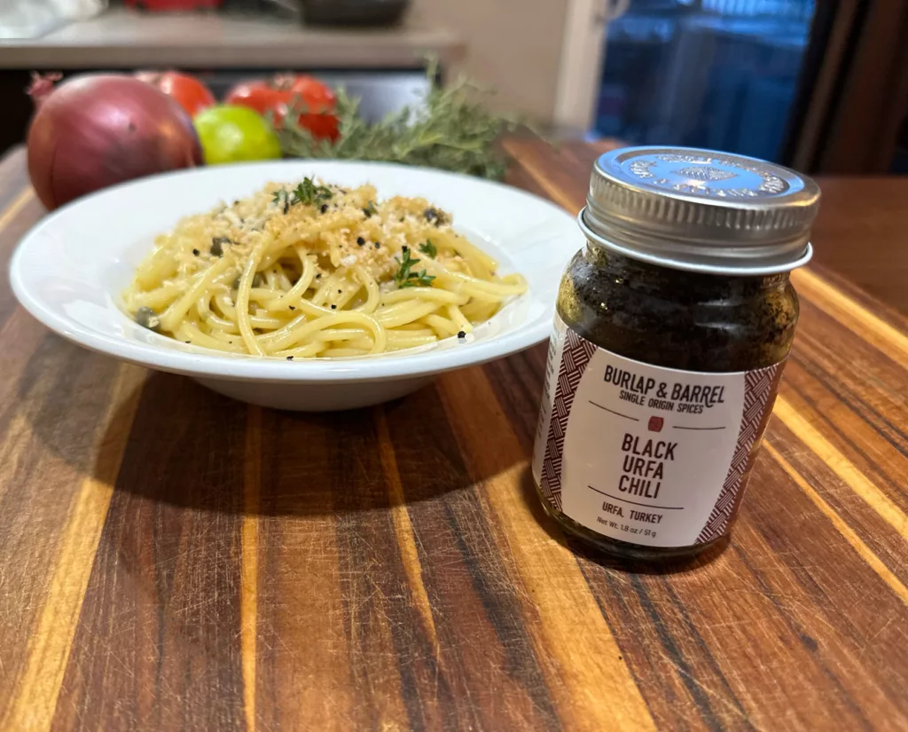 One-pan garlic and caper spaghetti made with black urfa chili from Burlap and Barrel.