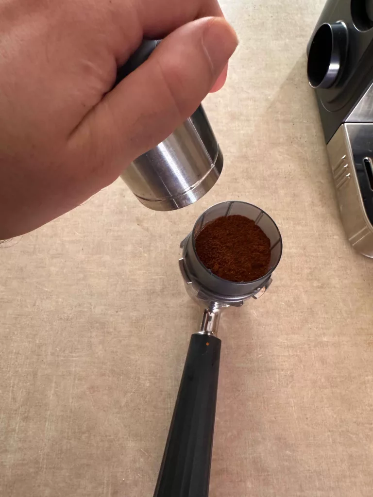 Ninja Luxe Cafe portafilter, funnel, and spring loaded tamper.