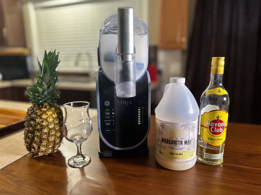 Making Piña Coladas using Margarita Man mix and the Ninja SLUSHi.