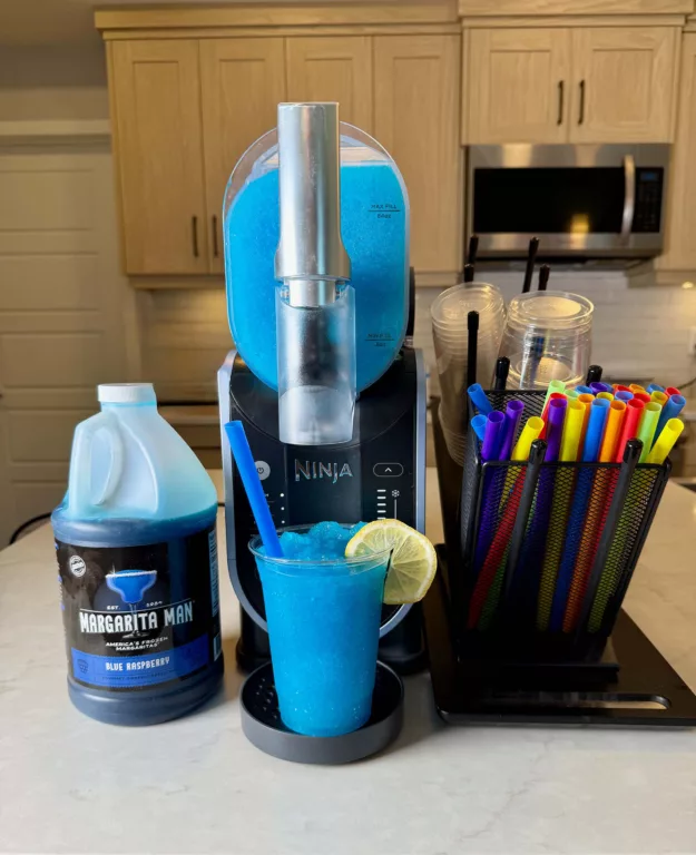 Blue Raspberry Slushed Drink made with Ninja SLUSHi and Margarita Man mix.