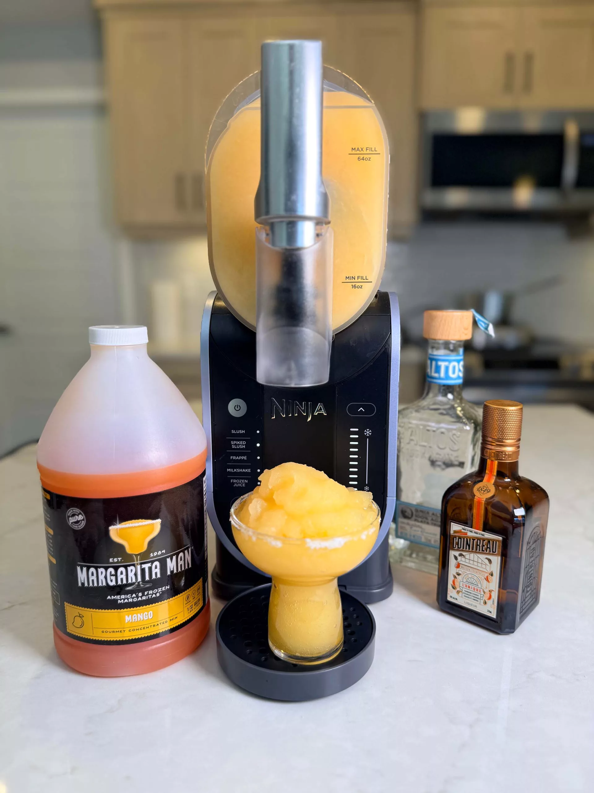 Mango Margaritas made with Margarita Man mix and the Ninja SLUSHi.